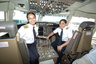 Capt. Chang-Leng (left) and First Officer Peermohamed-Matharu in the plane’s cockpit after their successful flight from Mauritius 