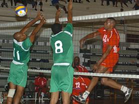 Racing Club’s captain Andy Ally (right) beats the Beau Vallon block