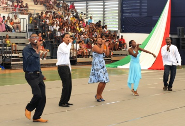 The composer of the theme song, Raymond Clarisse (left), accompanied by four other artists, perform the song