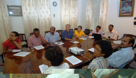 Mr Faure (at head of table) presenting the ministry’s new structure to members of the media in the presence of heads of the various sections