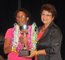 A representative from St Louis accepts the Minister’s Cup for the best literacy centre