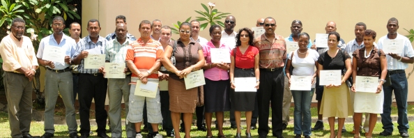 Long serving staff in a souvenir photograph with guests