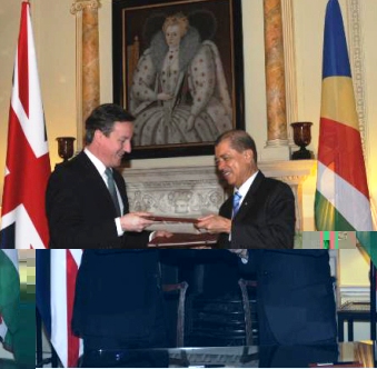 President Michel and Prime Minister Cameron exchange documents after signing the MoU