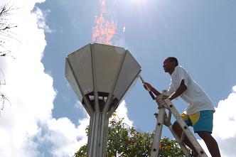 Athlete Antoine Asba lights the flame