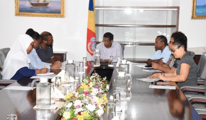 Social workers discuss project proposal with President Faure