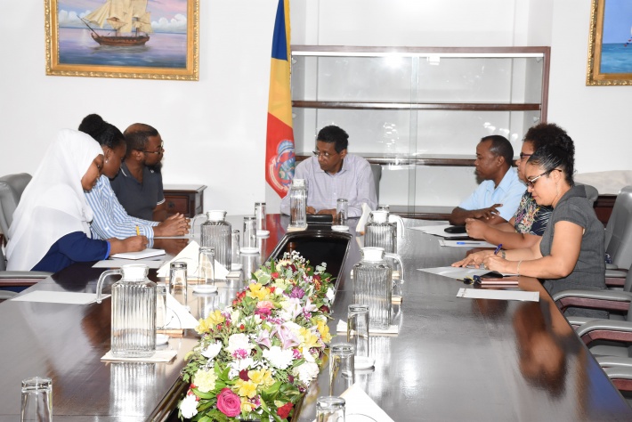 Social workers discuss project proposal with President Faure