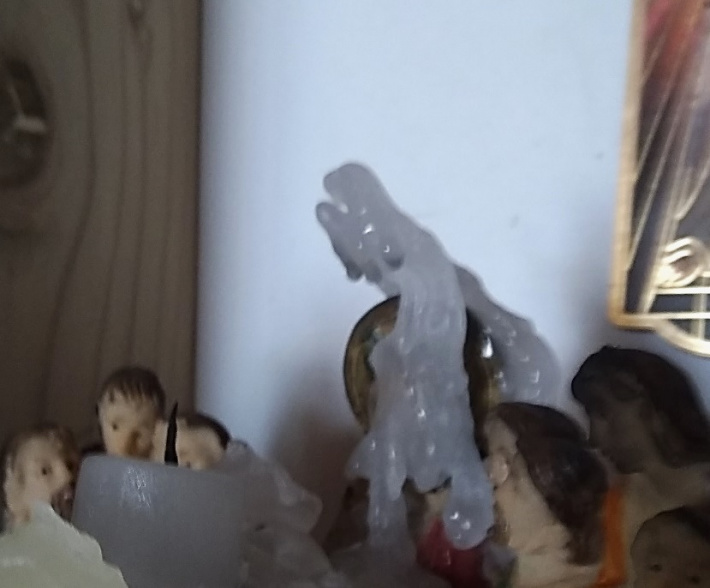 Candle wax melts into a distinctively miraculous Virgin Mary Figure