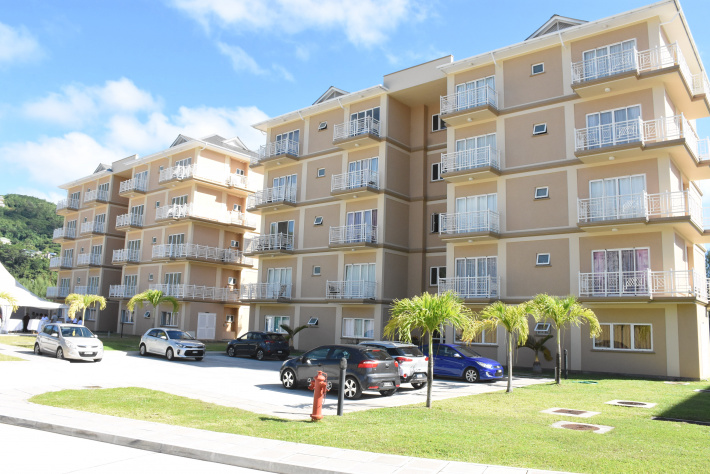 Ten families get keys to their new condos