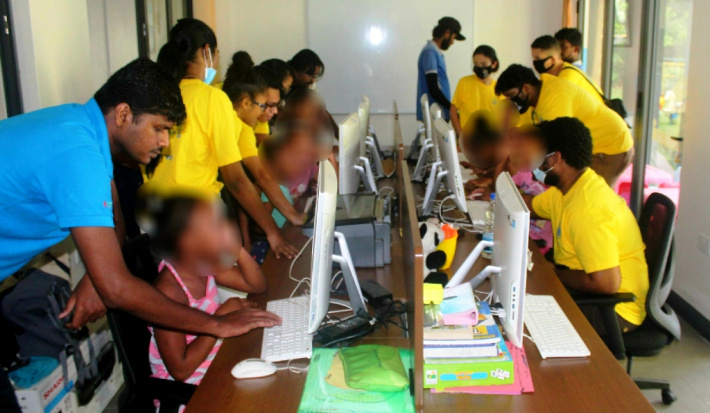 Seychelles Rising Lions Clubs, Nisti teach computer literacy to orphans