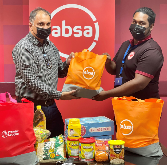 Absa Bank Seychelles helps Red Cross Society stock food and sanitary items for families in need