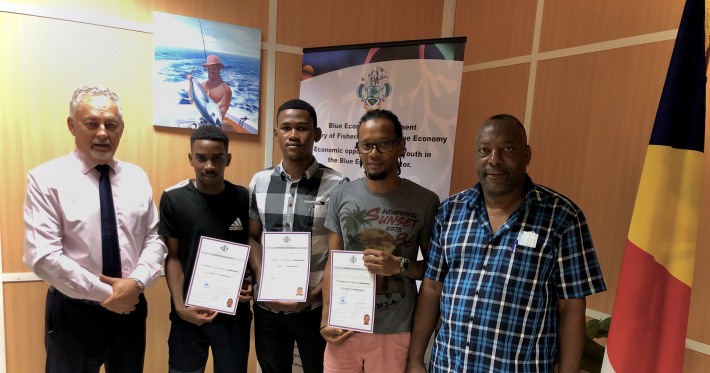Three young Seychellois receive certificate after completing training in maritime safety   