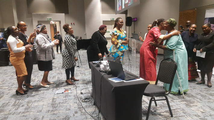 Members of Parliament from SADC attending a Joint Session of Standing Committees of the SADC PF in Johannesburg line up to congratulate Dr Nyaradzayi Gumbonzvanda (Photo: Moses Magadza)