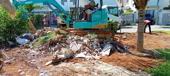 LWMA removes piled up construction debris at Ile Perseverance bin sites   