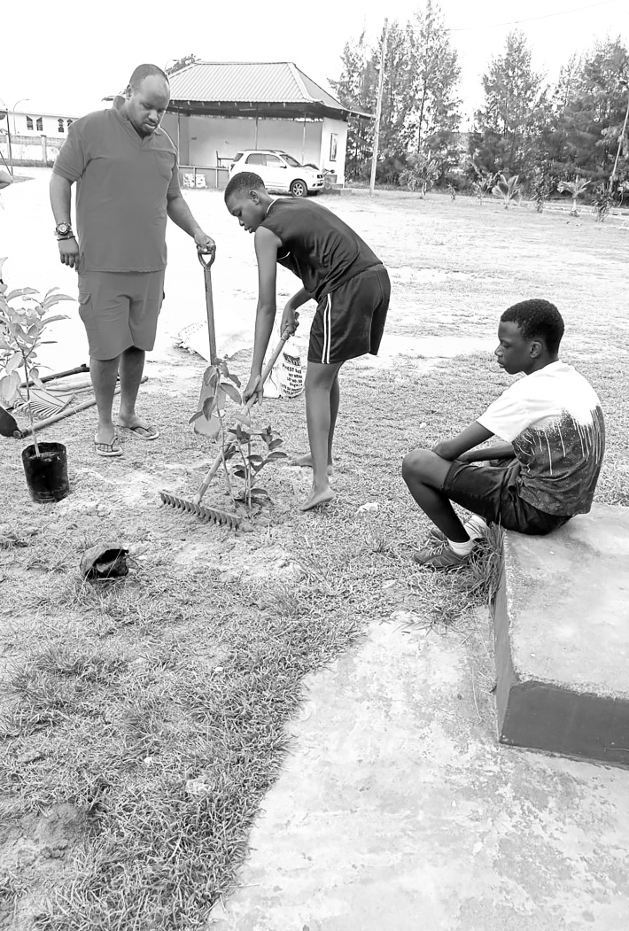 Lespri Seselwa plants trees at Holy Spirit parish