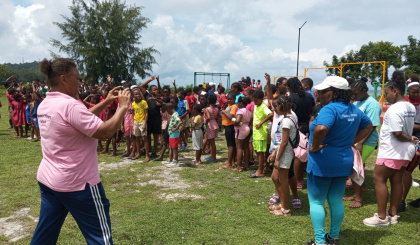 Schoolchildren walk through Persévérance on World Obesity Day