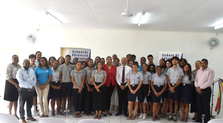 Minister Pierre presents Golden Jubilee gifts to students