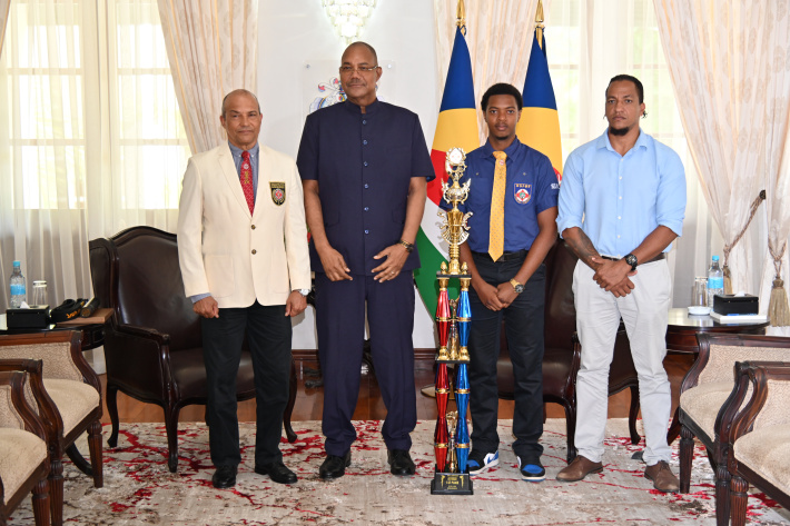 President Herminie congratulates karatekas Samuel Fanny, Phillip Moustache